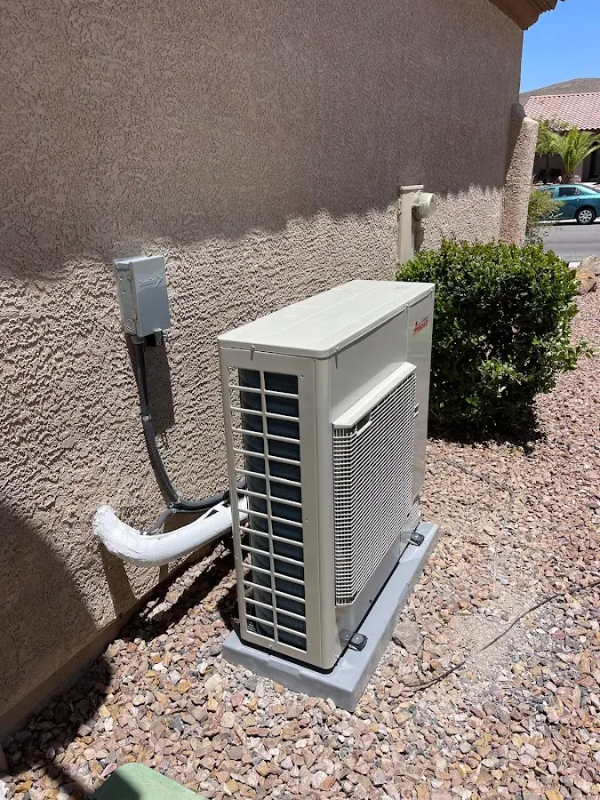 Residential air conditioning condenser unit in Monticello